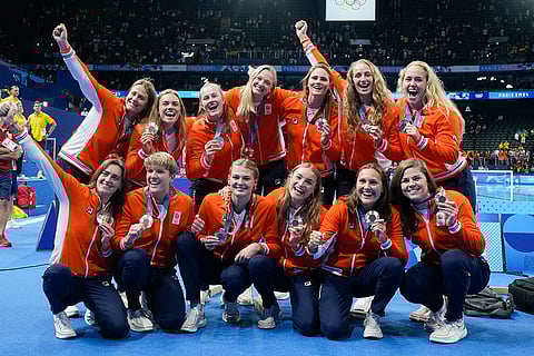 Women's water polo: Netherlands' team celebrate after winning bronze